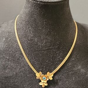Simmons Gold Tone Necklace with Blue Floral Design